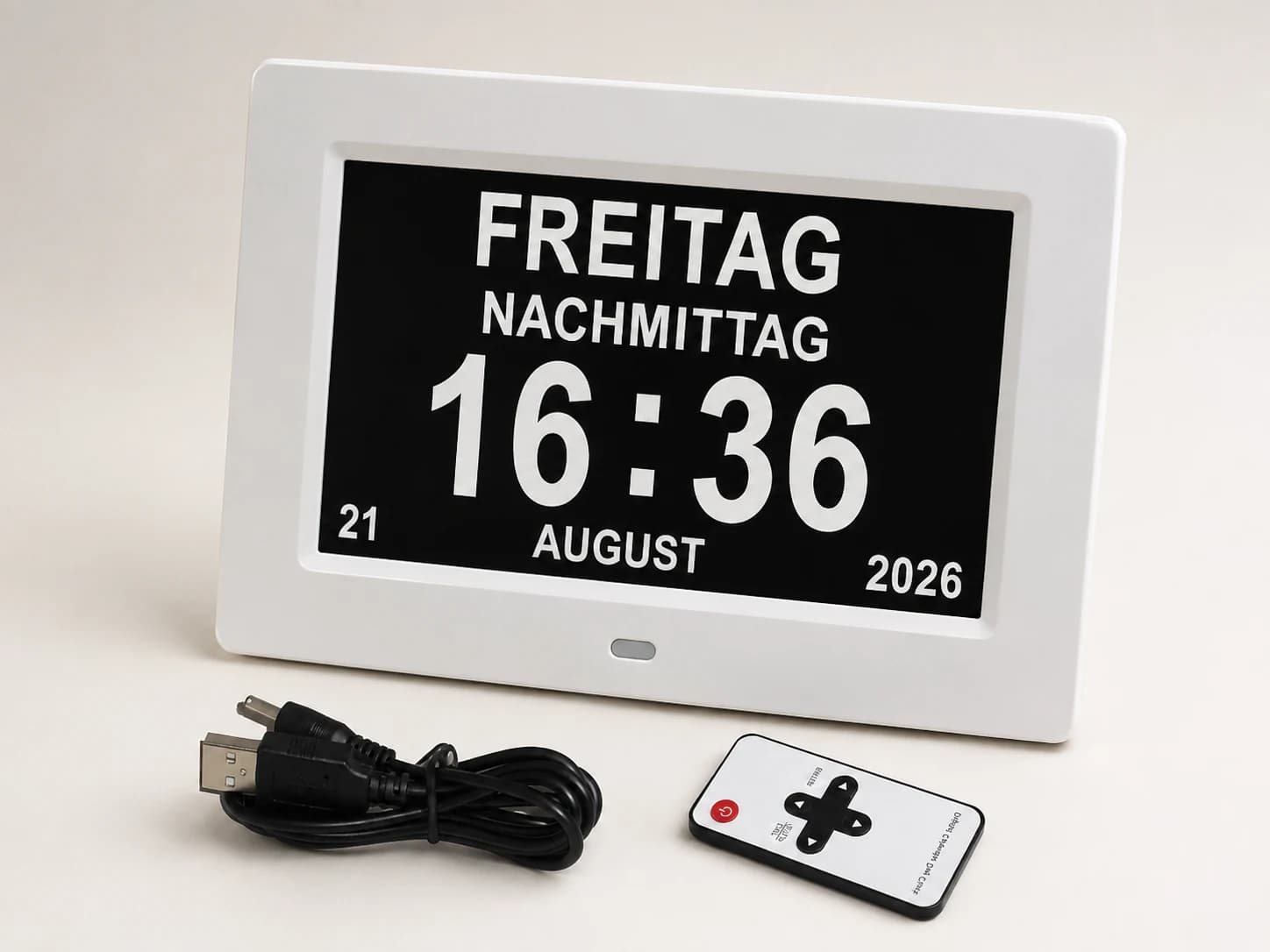 White calendar clock with German display, remote and USB cable
